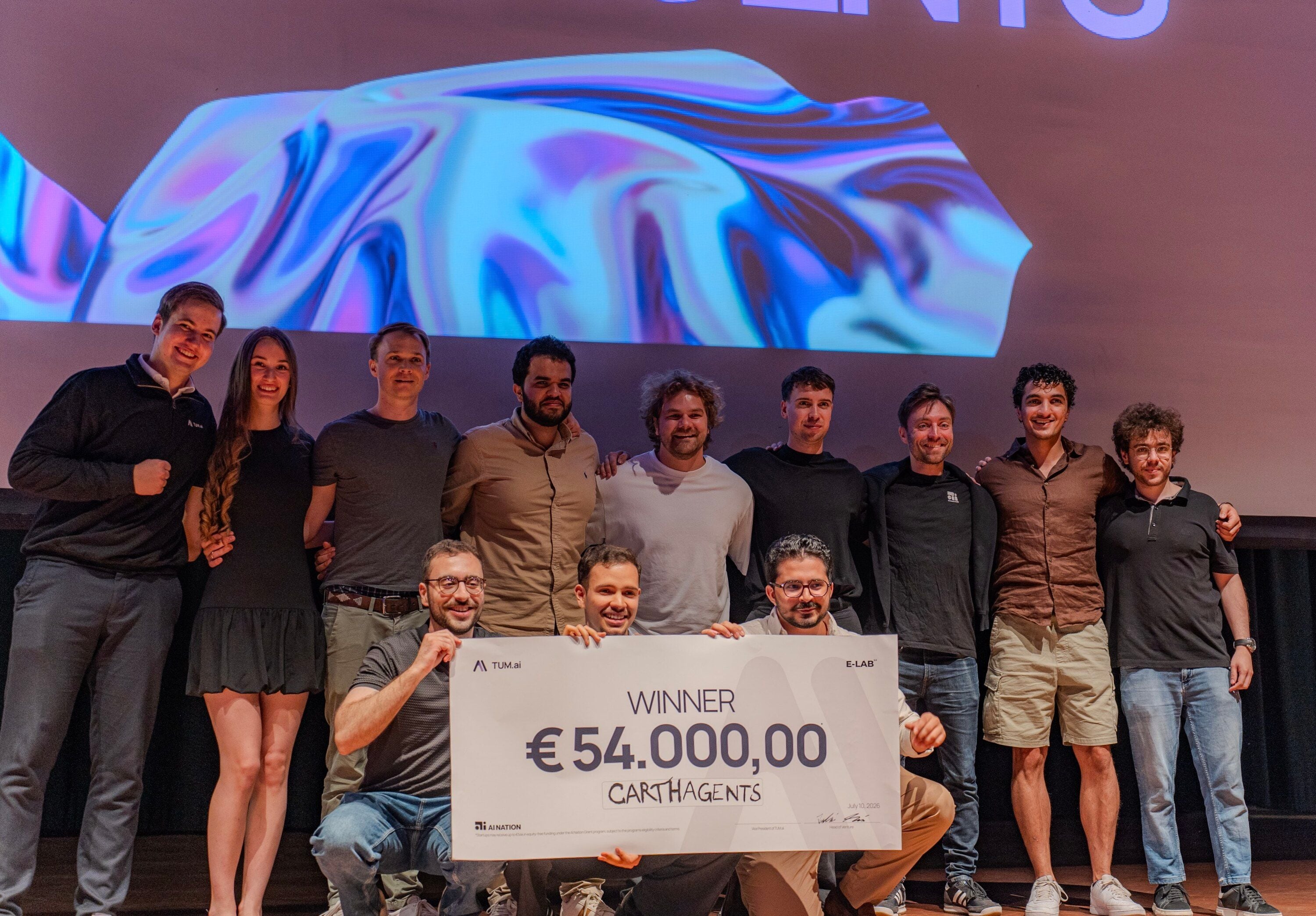 The winning team CarthAgents and the organisers on stage with a €54,000 cheque